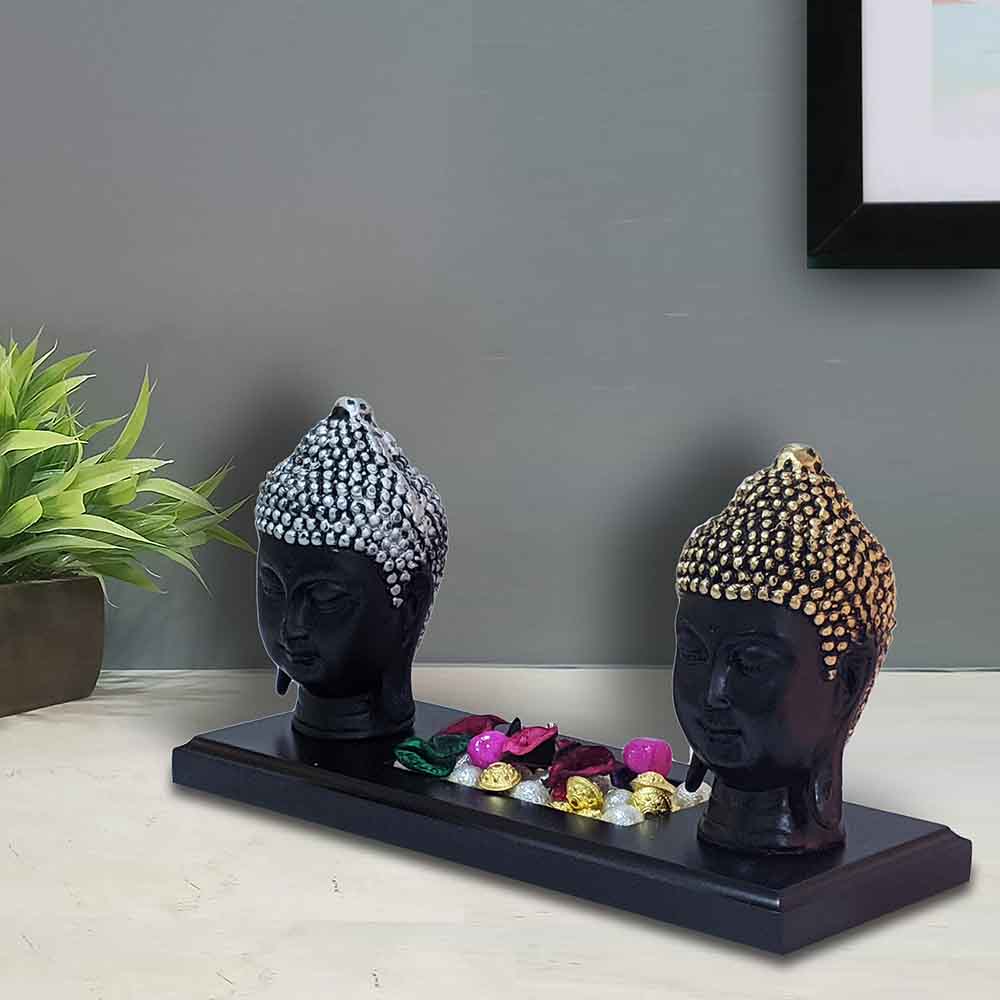Buddha Face Idol on Wooden Platform